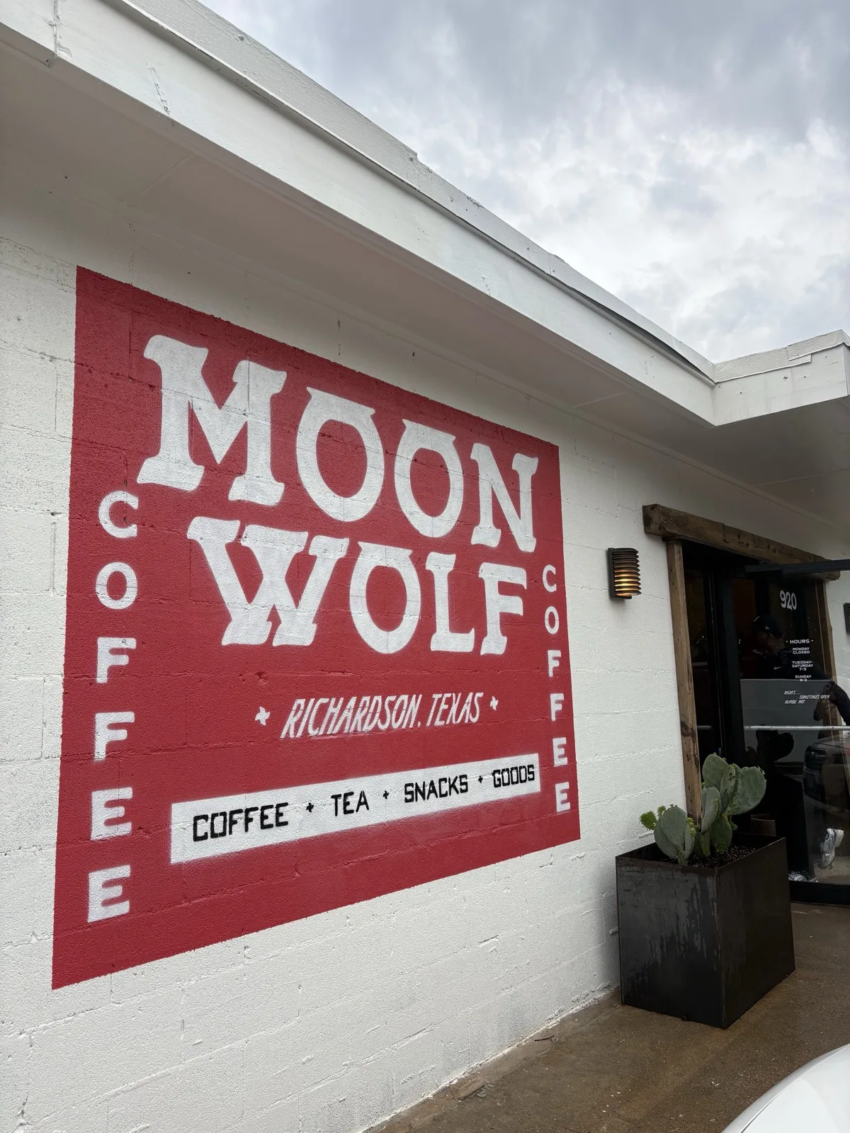 Moon Wolf Provisions storefront sign in red and white